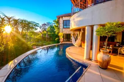 a large swimming pool in front of a house at 7 Saint Andrew in White River