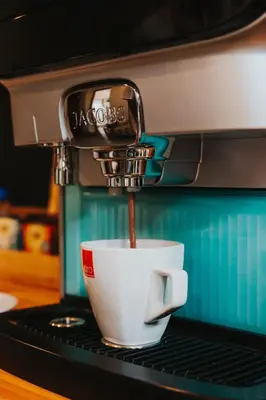 a coffee maker is making a cup of coffee at Execustay in Nelspruit