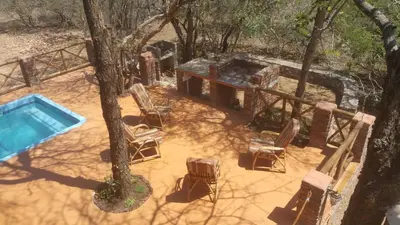 an overhead view of a swimming pool and chairs at Marlothii Safari House in Marloth Park