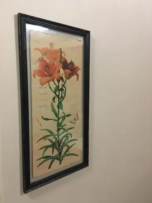 a picture of a painting of flowers on a wall at Riverton Manor in Centurion