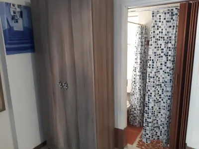 a door to a room with curtains and a window at 29 Polvy Street in Nelspruit
