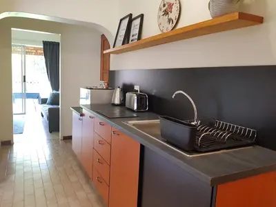 a kitchen with a sink and a counter top at Kington Guest Suite in Pretoria