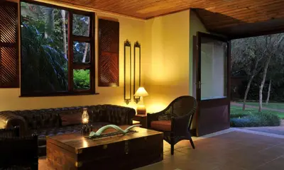 a living room with a couch and a table at Hazyview Sun in Hazyview