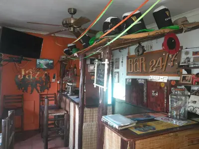 a bar with a bar sign on the wall at 1322 Backpackers International in Pretoria