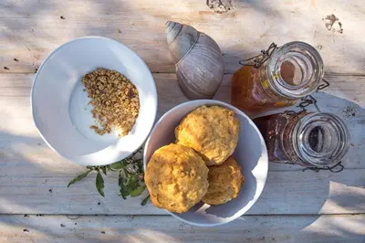 a table with a bowl of food and a bowl of nuts at Pungwe Safari Camp in Manyeleti Game Reserve