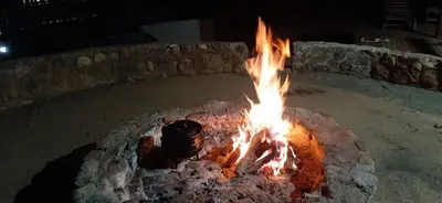 a fire oven with a pot on top of it at Dream Of Nature in Bela-Bela
