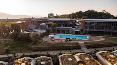 an aerial view of a building with a swimming pool at Angels View Hotel in Graskop
