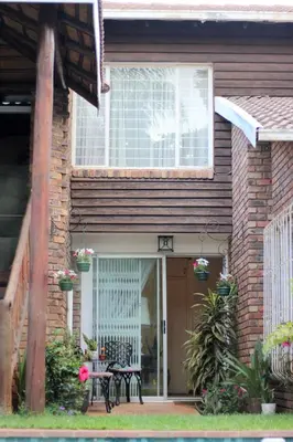 a house with a door and a table in front of it at 513 on Mulberry in Pretoria