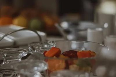a table topped with glass bowls of food on a table at Three Olives Guesthouse in Centurion