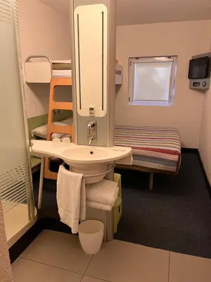 a bathroom with a sink and a bunk bed at SUN1 MIDRAND in Midrand