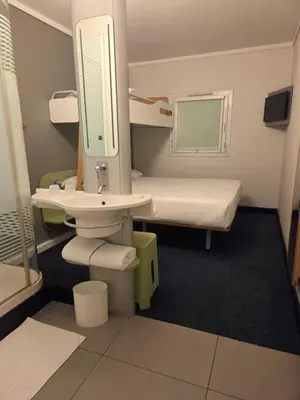 a hospital room with a sink and a bed at SUN1 MIDRAND in Midrand