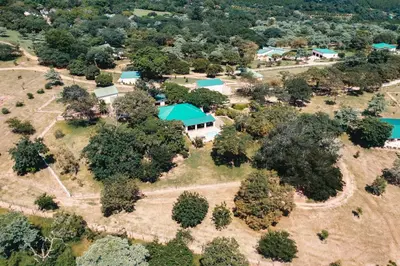 an aerial view of a house with trees at Bergdale Cottages in Hazyview