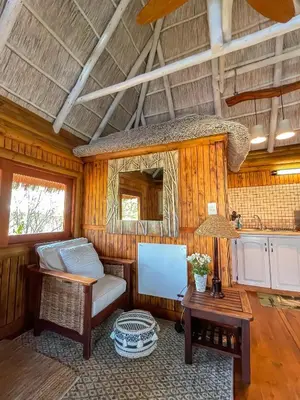 a living room with a couch and a table at iKhaya LamaDube Game Lodge in Klipdrift