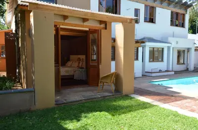 a house with a patio and a swimming pool at Bed & Breakfast in Hatfield in Pretoria