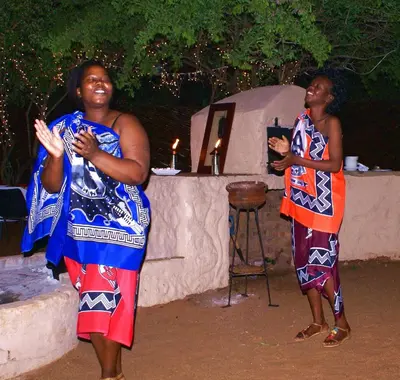 two women are standing in front of a tent at Crocodile Kruger Safari Lodge in Marloth Park