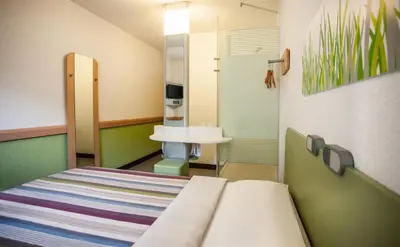 a hospital room with a bed and a sink at SUN1 PRETORIA in Pretoria