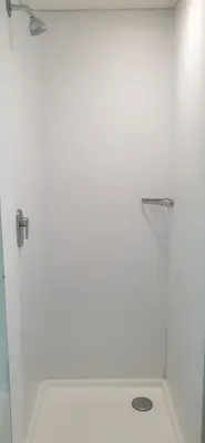 a white bathroom with a shower and a toilet at SUN1 BENONI in Benoni