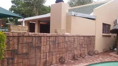 a retaining wall in front of a house at hanna's place in Polokwane