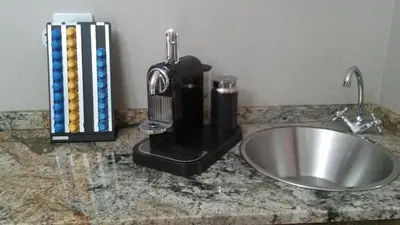 a mixer sitting on a counter next to a sink at hanna's place in Polokwane
