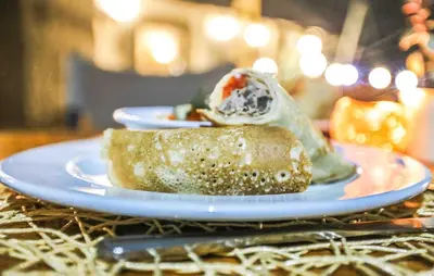 a plate of food on top of a table at Kruger Adventure Lodge in Hazyview