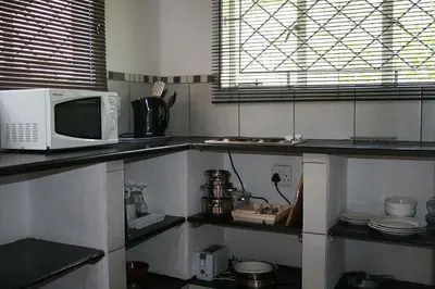 a kitchen with a microwave and a counter top at Sabie Star in Sabie