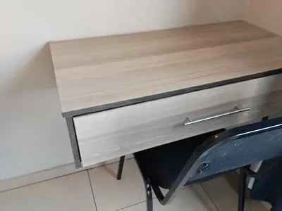a wooden desk with a chair next to it at Tokelo Guesthouse Emalahleni in Witbank