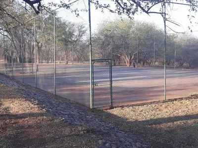 a tennis net on a tennis court at Little Bush Baby in Marloth Park