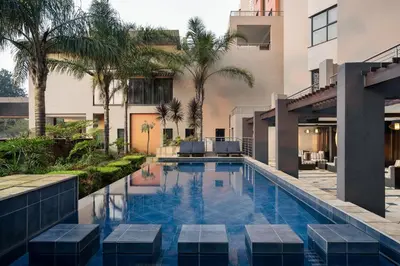 a swimming pool in the middle of a building at Premier Hotel O.R. Tambo in Kempton Park