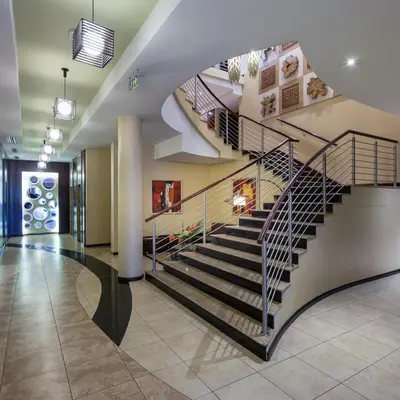 a spiral staircase in a building with a lobby at Premier Hotel O.R. Tambo in Kempton Park