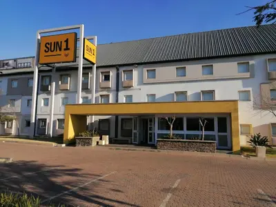 a large building with a sign in front of it at SUN1 WITBANK in Witbank