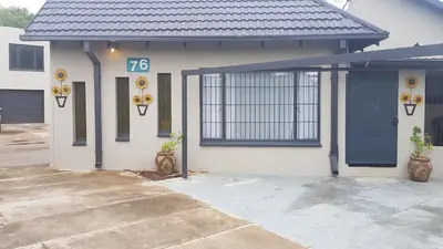 a house with a number on the side of it at Favour Guest house in Polokwane