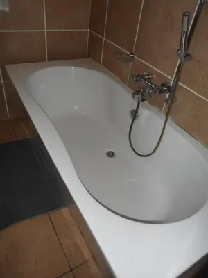 a white bath tub with a faucet in a bathroom at Home @ Harry's in Pretoria
