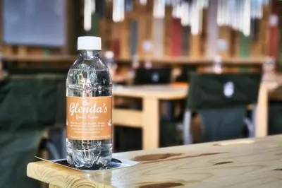 a bottle of water sitting on top of a table at Glenda's Guest Suites in Midrand