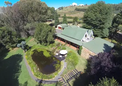 an aerial view of a house with a green roof at Stonecutters Lodge in Dullstroom