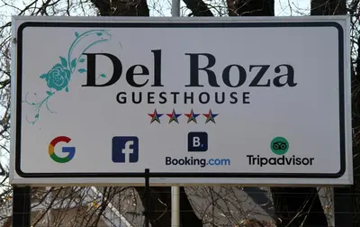 a sign for a del rosa guinnessswick at Del Roza Guest House in Middelburg