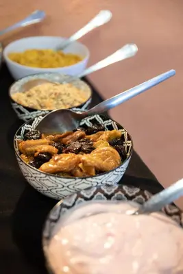 two bowls of food on a table with dips at Blyde River Canyon Lodge in Hoedspruit