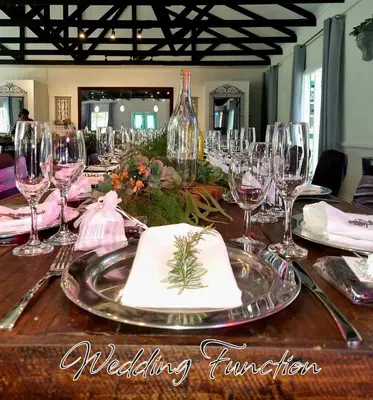 a table with wine glasses and napkins on it at Silver Mist Guest House, Country Inn and Herberg in Kaapsehoop
