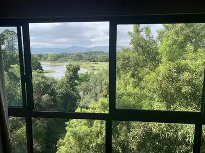 a view of a river from a window at Migdash Guesthouse in Hartbeespoort