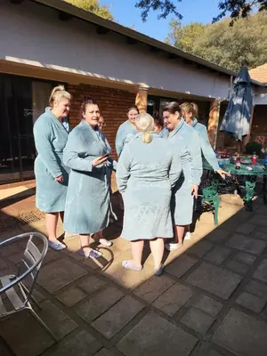 a group of people in blue robes standing together at Guesthouse Serenity in Hartbeespoort