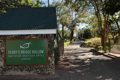 a sign for the phylys fence hollow therapeutic sculpture project at Perry's Bridge Hollow Boutique Hotel in Hazyview