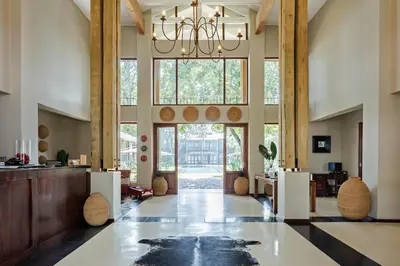a large lobby with a chandelier in a building at Casterbridge Hollow Boutique Hotel in White River