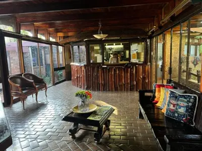 a living room with a couch and a table at Vido Lodge and Conference Centre in Polokwane