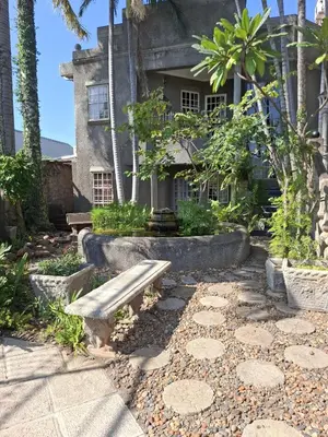 a bench sitting in front of a building at Belvedere-on-River in Malelane