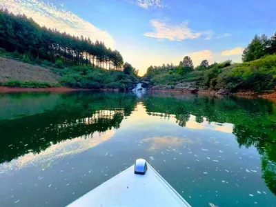 a boat in the water on a river at Stanford Lake lodge in Haenertsburg