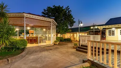 a house with a porch and a patio at Little Pilgrims Boutique Hotel in Hazyview