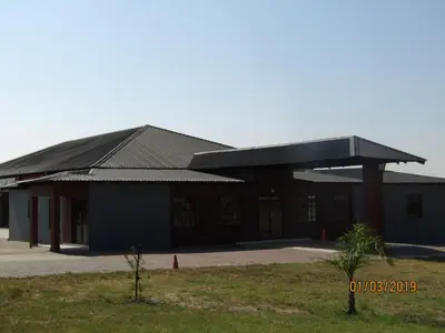 a large building with a gambrel roof at Vido Lodge and Conference Centre in Polokwane