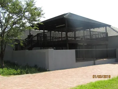 a building with a staircase on top of a wall at Vido Lodge and Conference Centre in Polokwane
