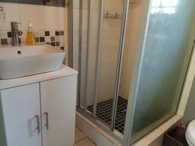 a bathroom with a shower and a sink at African Sky in Marloth Park