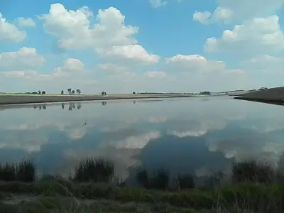 a body of water with a reflection of the sky at Green Thumb Farm Stay in Ermelo