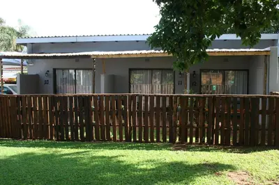 a wooden fence in front of a house at Purdy's Place in Louis Trichardt